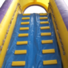 Close-up of adults landing in the splash pool at the bottom of the slide