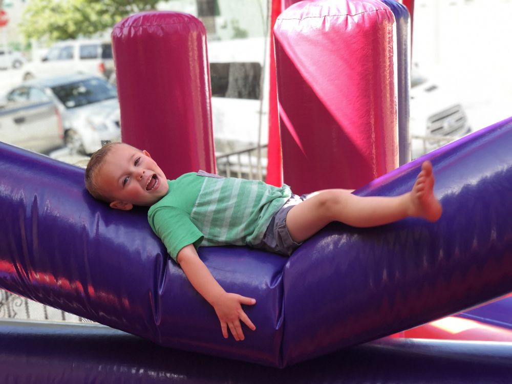 Happy Kids on Purple Jumping Castle